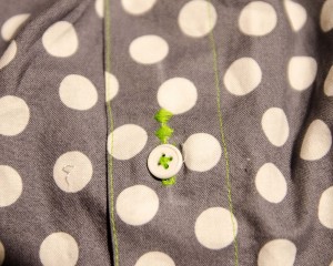 Fancy stitches to cover up cut button hole